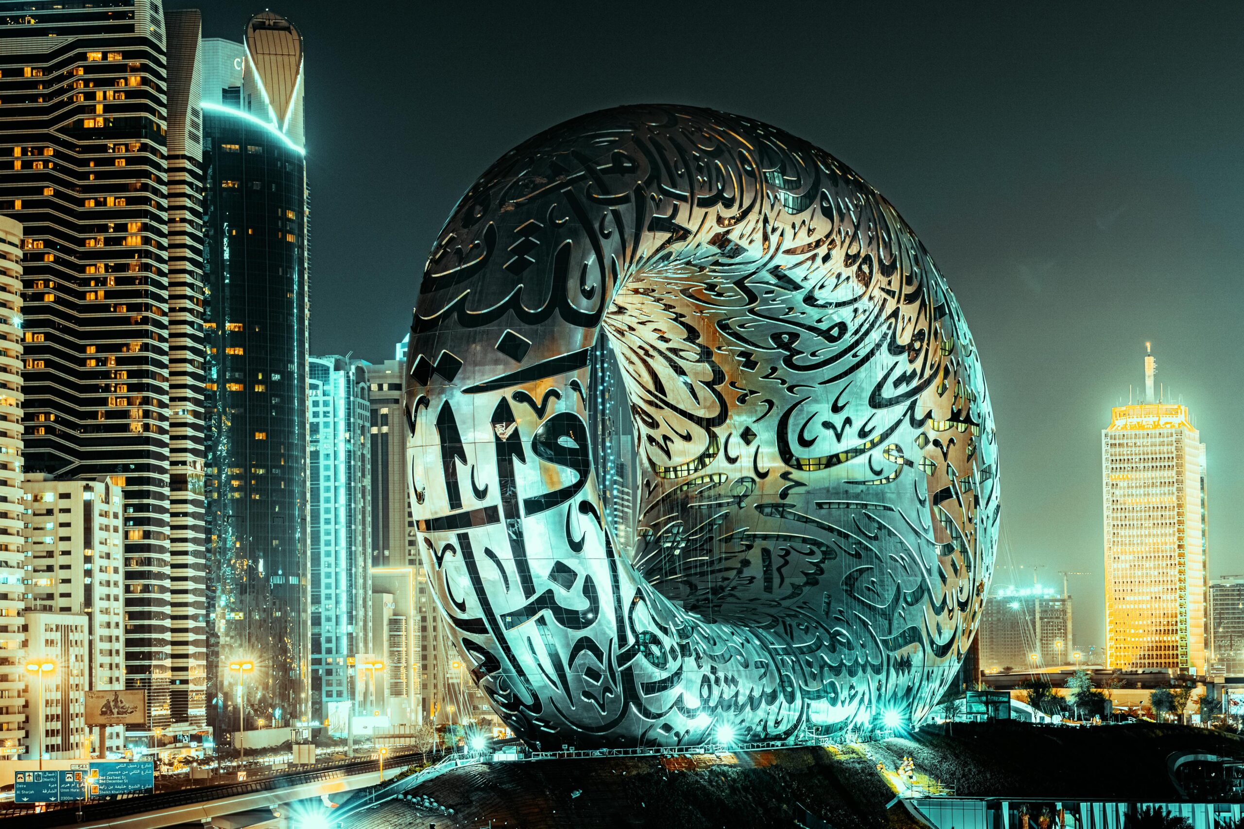The Museum of the Future illuminated at night against the Dubai skyline, showcasing modern architecture.